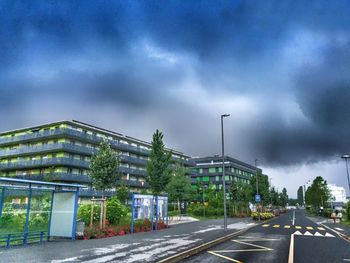 City street against cloudy sky