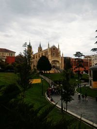 High angle view of buildings against cloudy sky