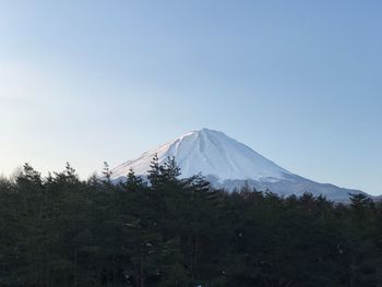 Scenic view of mountains against clear blue sky