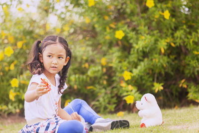 Cute girl sitting outdoors