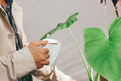 Midsection of man holding ice cream