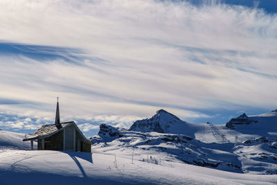 Scenic view of snowcapped mountains against sky