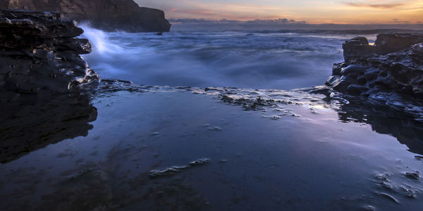 Scenic view of sea against sky during sunset