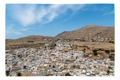Aerial view of townscape against sky