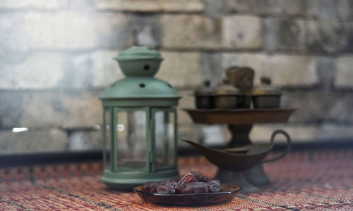 Close-up of drink on table against wall