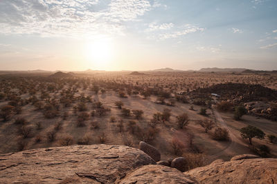 Scenic view of landscape against sky during sunset