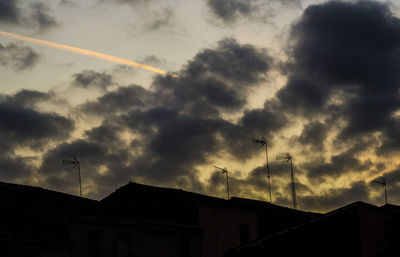 Low angle view of silhouette birds against sky