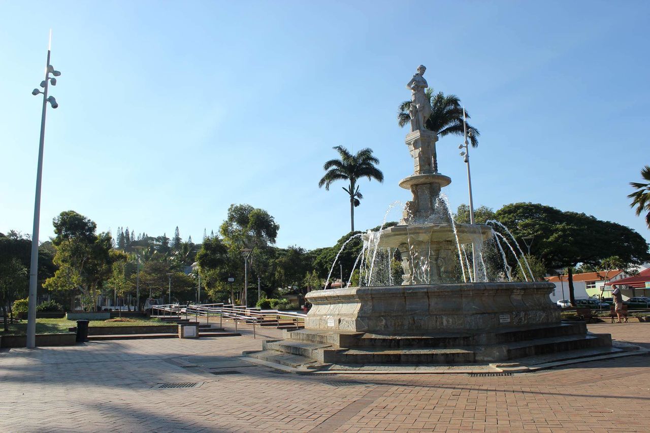 statue, sculpture, human representation, tree, day, outdoors, travel destinations, palm tree, sky, no people, architecture