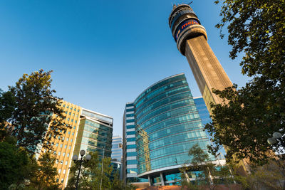 Low angle view of buildings against blue sky