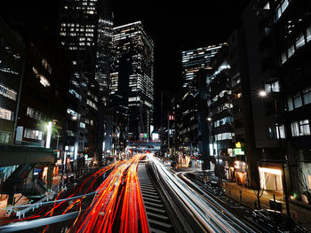 High angle view of illuminated buildings in city at night