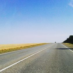 Empty road along landscape