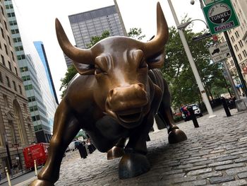 Low angle view of horse statue in city