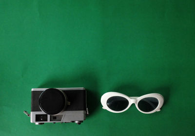 Directly above shot of sunglasses on table against wall