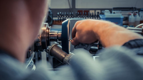 Close-up of man working in factory