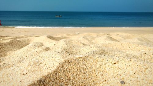 Scenic view of beach against clear sky