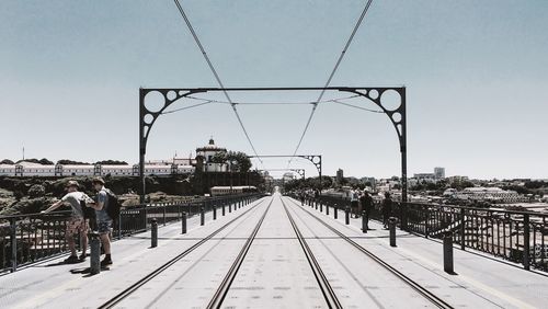 View of metal fence against clear sky