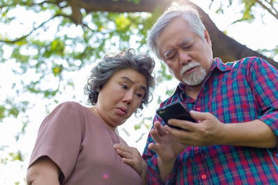 Portrait of man using mobile phone