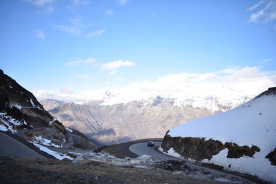 Scenic view of snowcapped mountains against sky