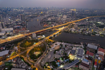 High angle view of illuminated cityscape at night