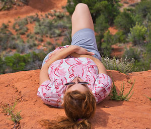 Woman lying on mud