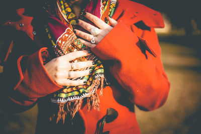 Midsection of woman wearing traditional clothing