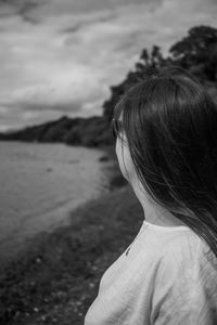 Rear view of woman looking at camera