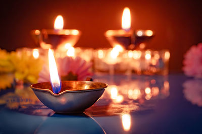 Close-up of illuminated tea light candles