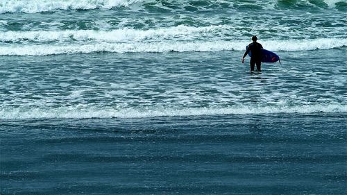 People surfing in sea