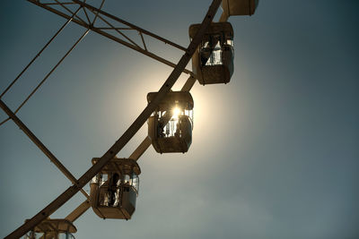 Low angle view of crane against sky