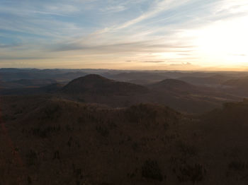 Scenic view of mountains against sky during sunset