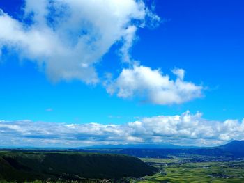 Scenic view of landscape against cloudy sky