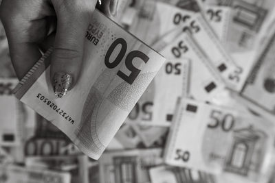 Cropped hand of man holding paper currency