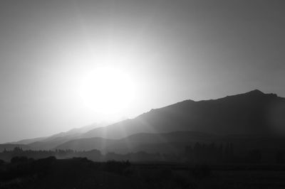 Scenic view of silhouette mountains against sky