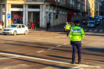 Man working on street in city