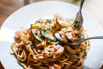 Close-up of tagliatelle pasta served in plate on table