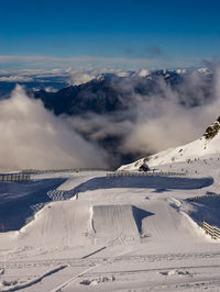 People skiing at treble cone against sky