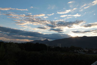 Scenic view of silhouette mountains against sky during sunset