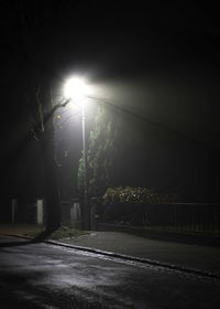 View of illuminated street at night