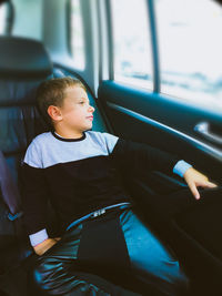 Boy sitting in car