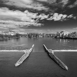 High angle view of marina in city against sky