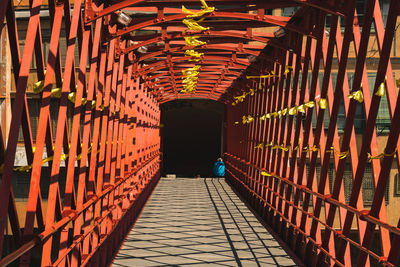 Low angle view of illuminated walkway in building