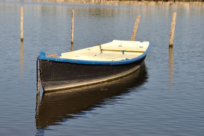 Boat moored in lake