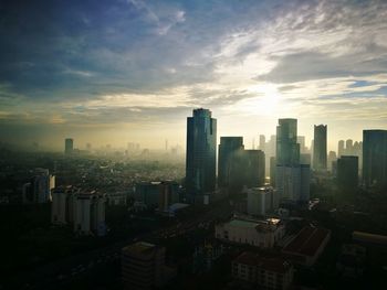 High angle view of buildings in city against sky