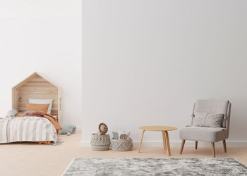 Empty white wall in modern child room. mock up interior in scandinavian, boho style. copy space  