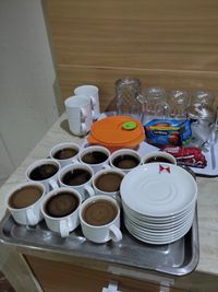 High angle view of coffee cups on table