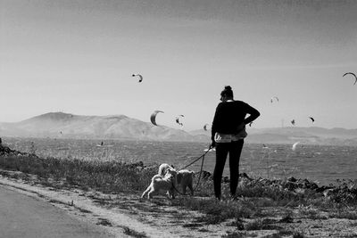 Full length of woman standing on landscape