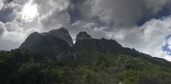 Scenic view of mountains against cloudy sky