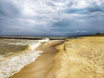 Scenic view of beach against sky