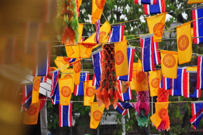 Multi colored flags hanging outside temple