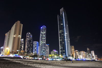 Low angle view of illuminated buildings at night